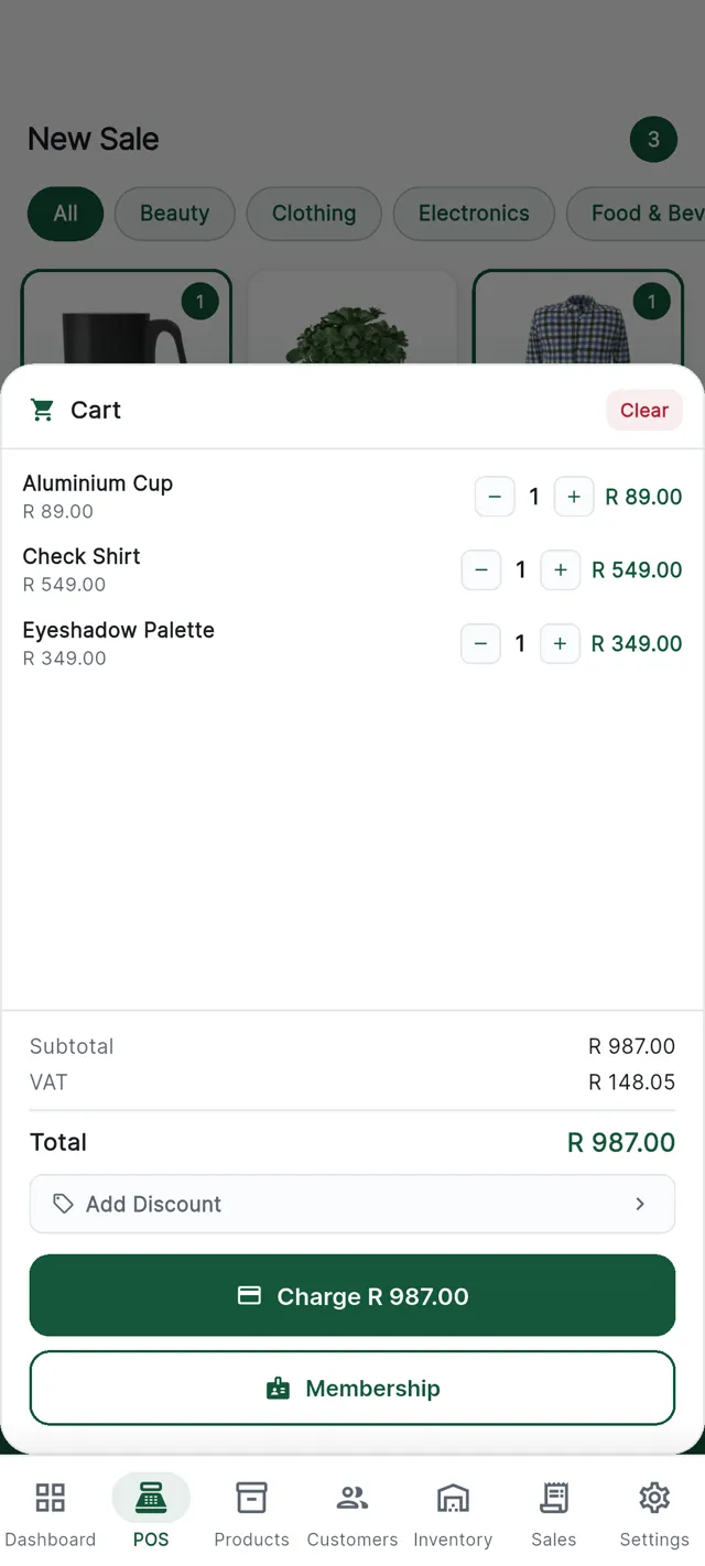 A cart on the CannyPos till with line items, VAT and the charge button.